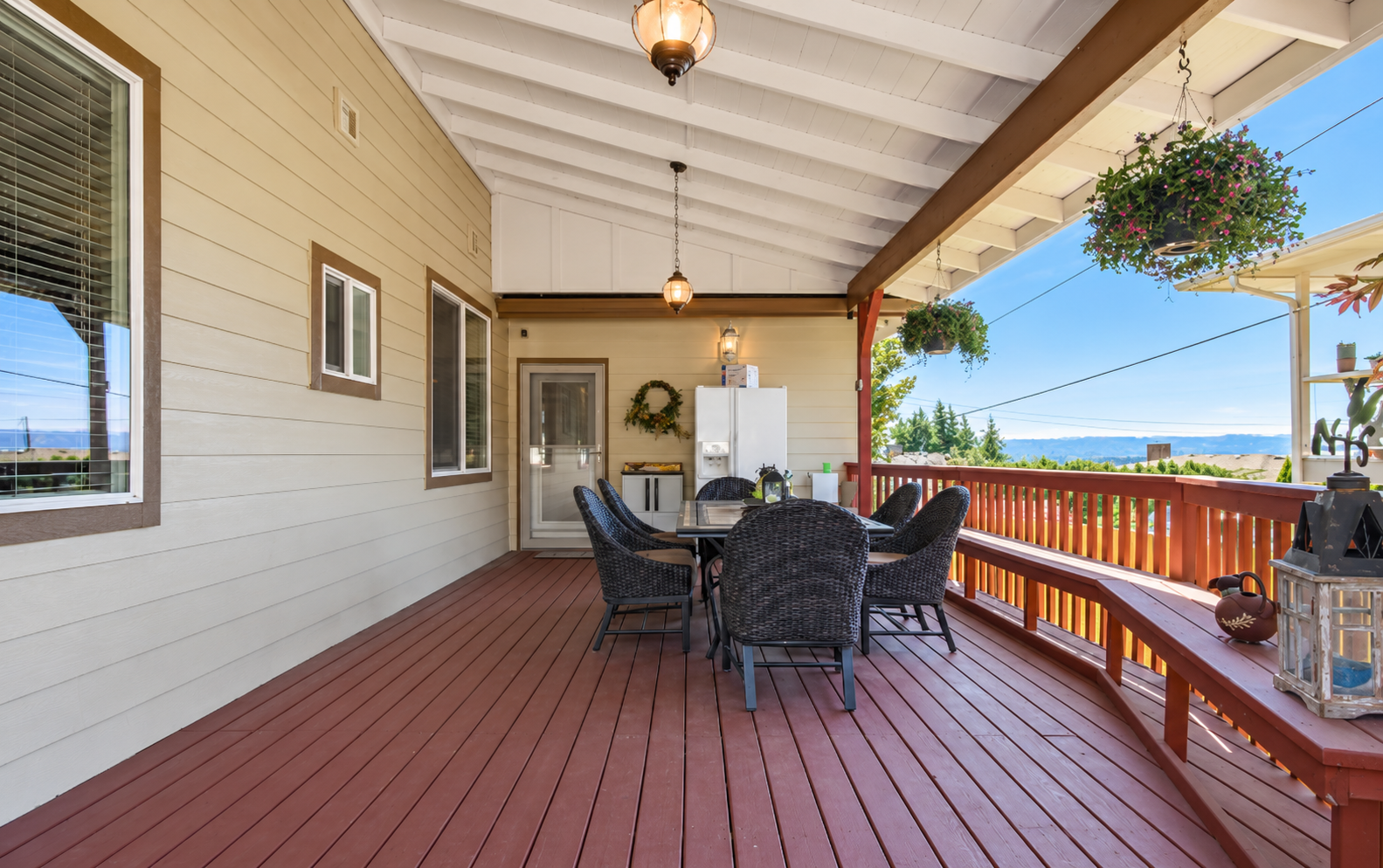 Sunlit covered deck with distant views